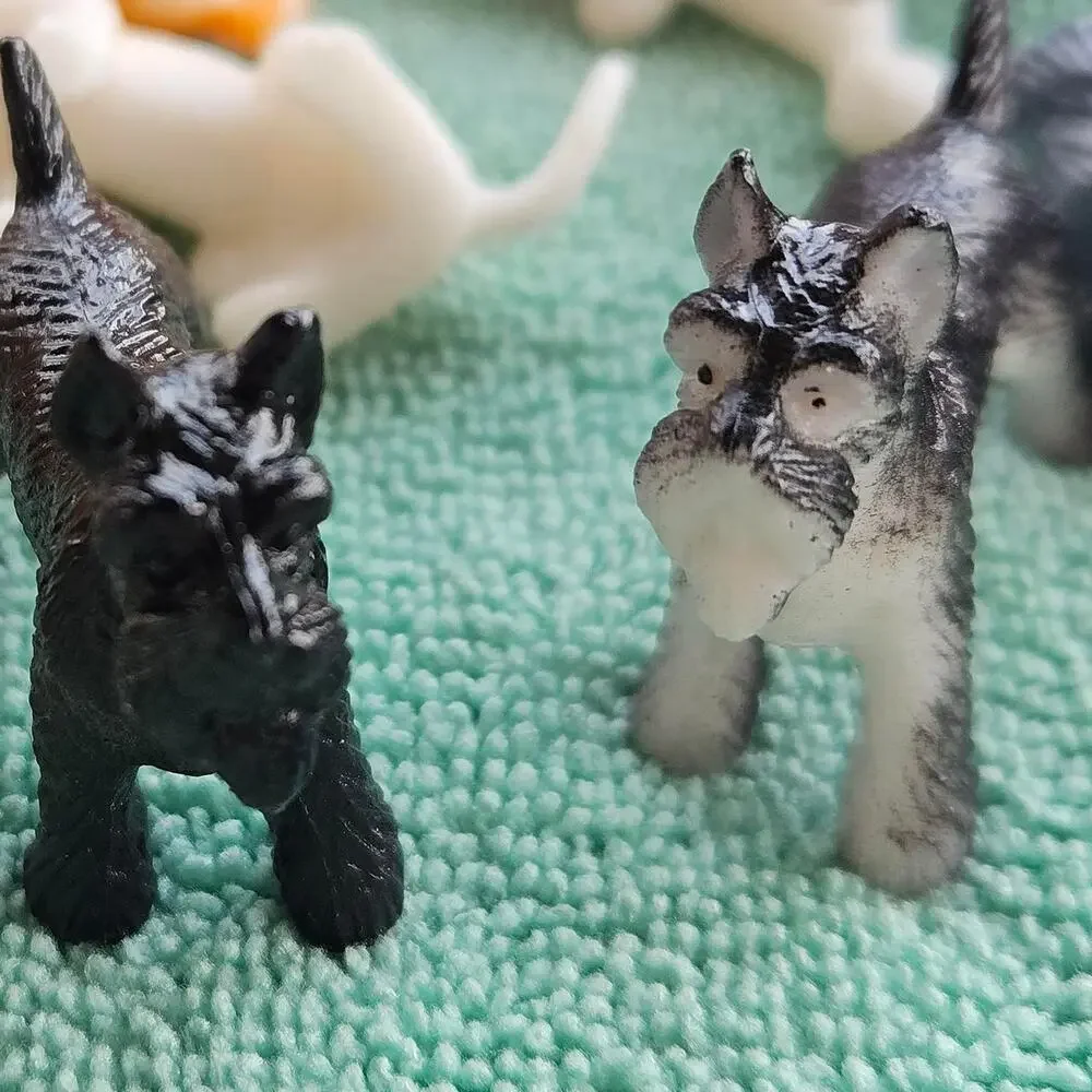 61 multi colored plastic dog figurines